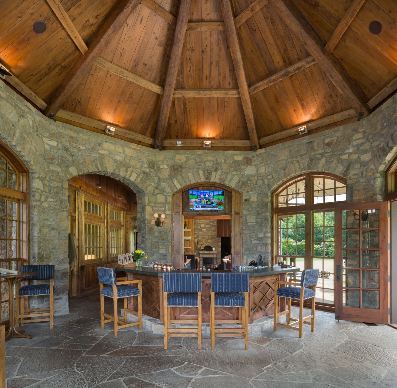 Diamond Creek Golf Club octagon bar room with radial timber ceiling and custom wood bar