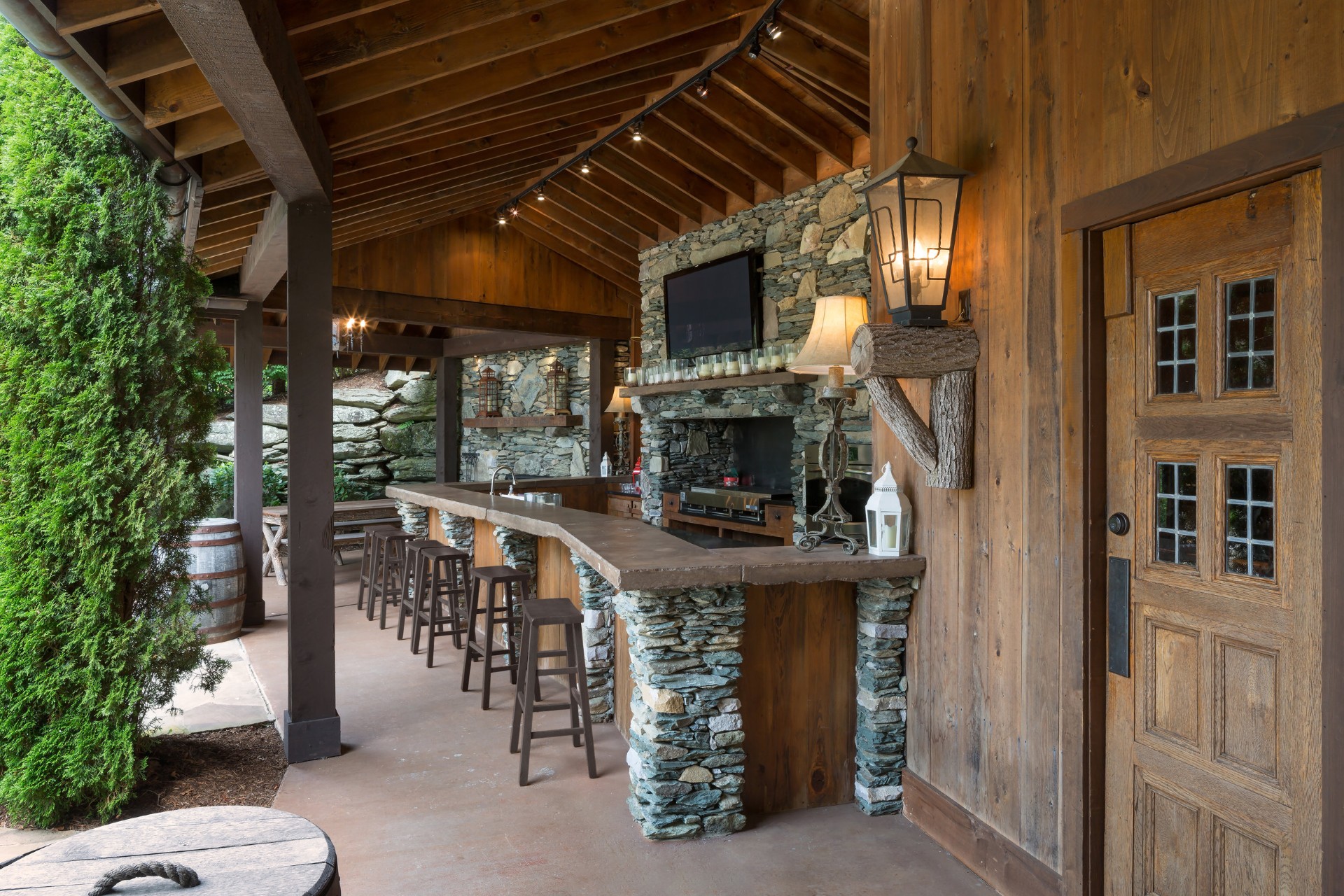 Diamond Creek shanty porch with timber frame ceiling and rocking chairs